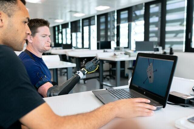 engineer developing prosthetic arm design